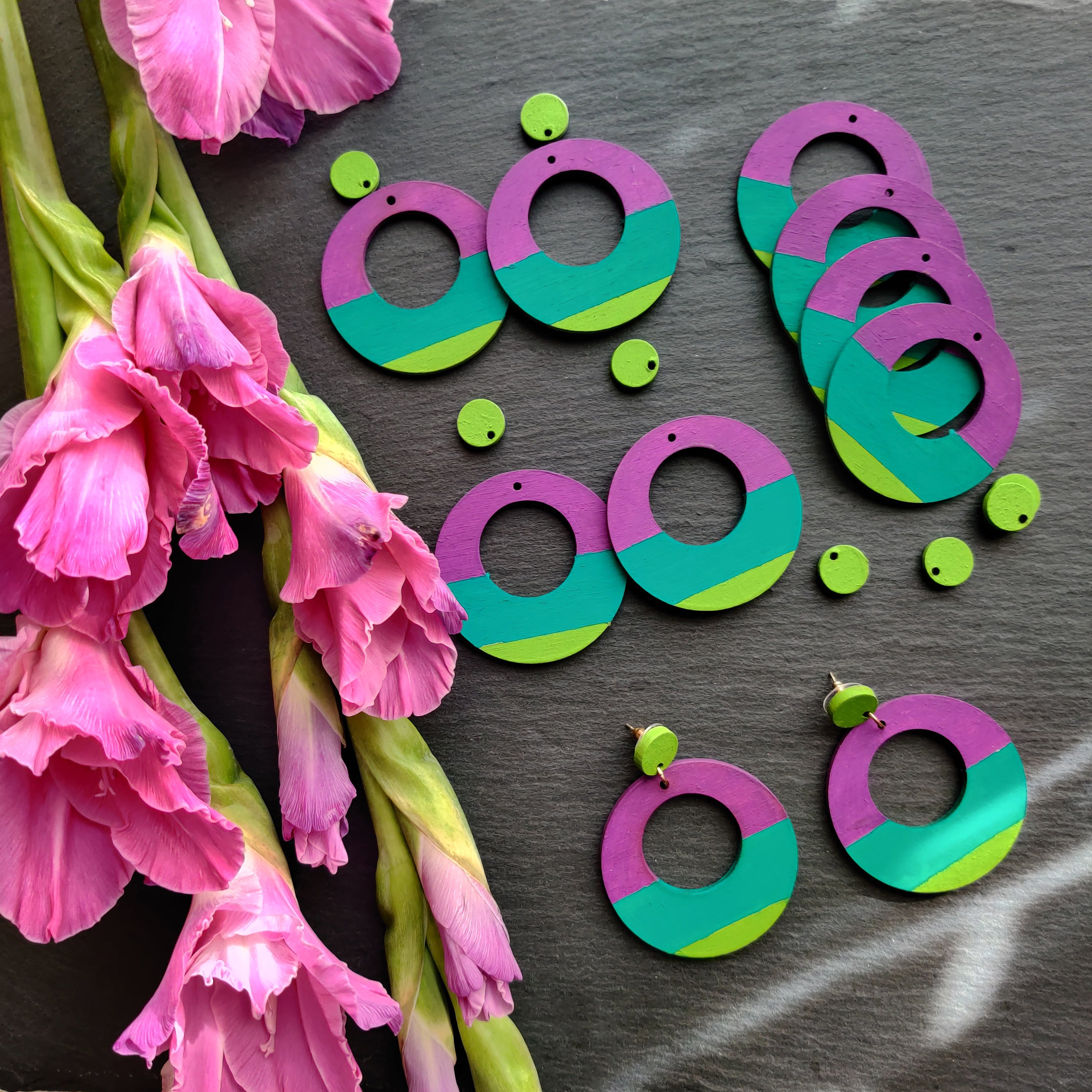Handcrafted large, round, chartreuse, teal and purple color blocked neutral tone statement earrings by the brand SCOTCHBONNET.