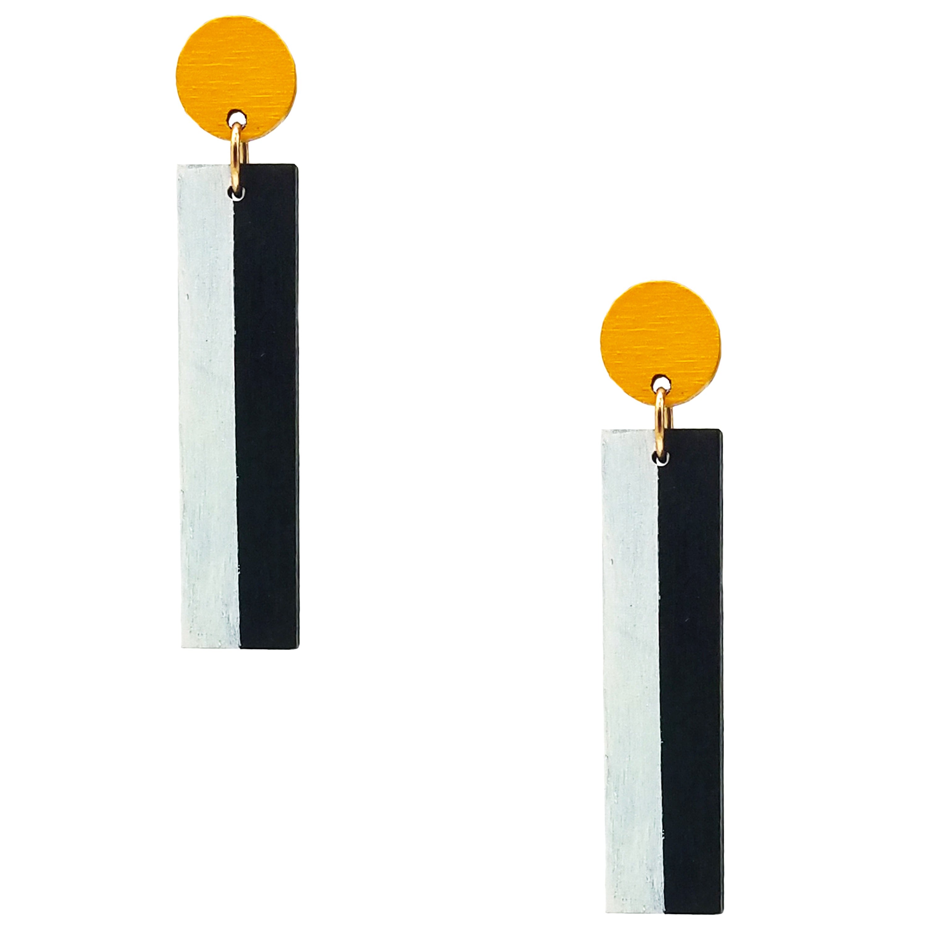 Geometric yellow, white, and black color blocked statement earrings by the brand SCOTCHBONNET.