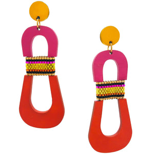 Modern, curvy, yellow, magenta and orange color blocked statement earrings with hand-beaded accents by the brand SCOTCHBONNET.