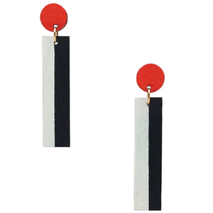 Geometric orange, white, and black color blocked statement earrings by the brand SCOTCHBONNET.
